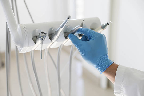 Professional Tooth Extraction technician working in Farmingdale, NY